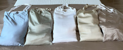 Bedding set wrapped as a housewarming gift for a new homeowner, with duvet cover and pillowcases
