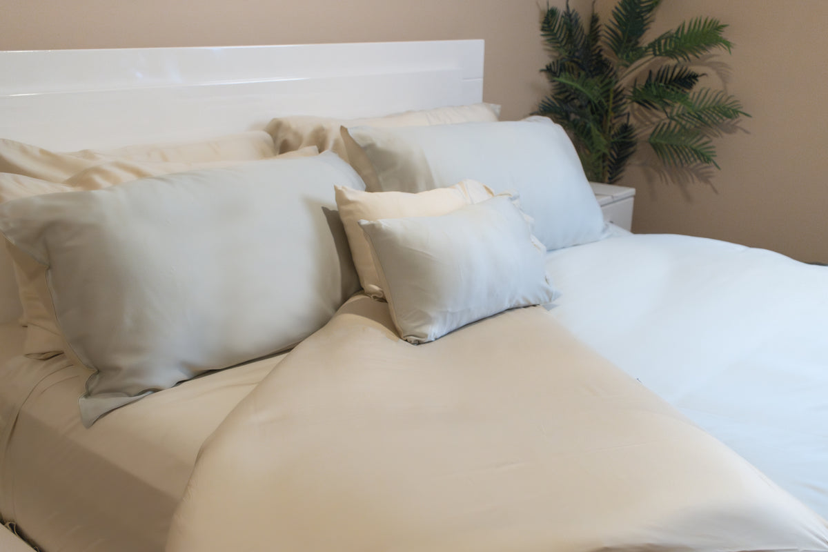 Comforter cover set with matching pillowcases made up on a bed