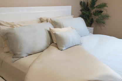 Comforter cover set with matching pillowcases made up on a bed