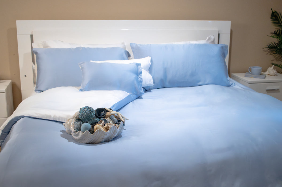Linen duvet cover with natural woven texture styled on a bed with pillows