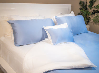 Housewarming gift bedding set displayed neatly in a gift-ready arrangement beside a styled bed