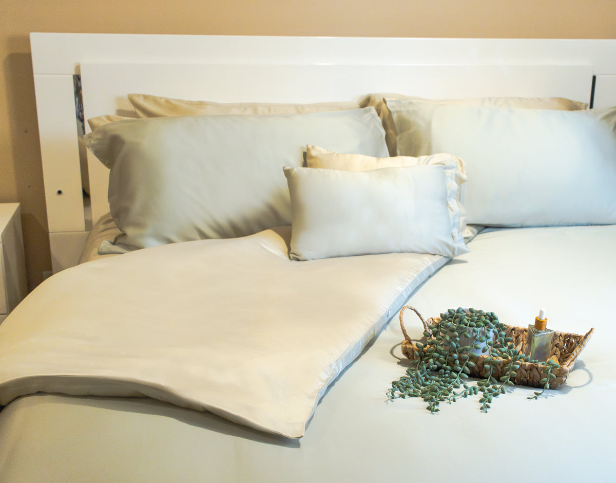 Breathable duvet cover in a soft fabric draped over a bed with pillows