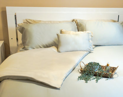 Breathable duvet cover in a soft fabric draped over a bed with pillows